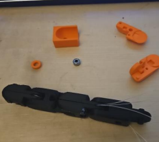Early finger components and tendon-routing development.